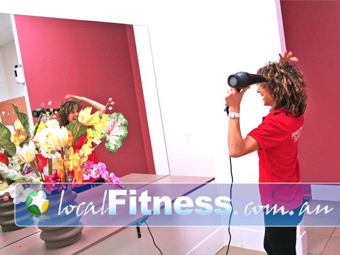 Genesis Health + Fitness Near Junction Village Clean and modern bathroom facilities.