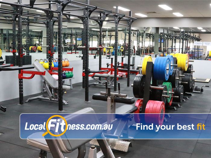 Genesis Health + Fitness Near Murrumba Downs The heavy duty strength zone with multiple lifting racks and deadlift platforms.
